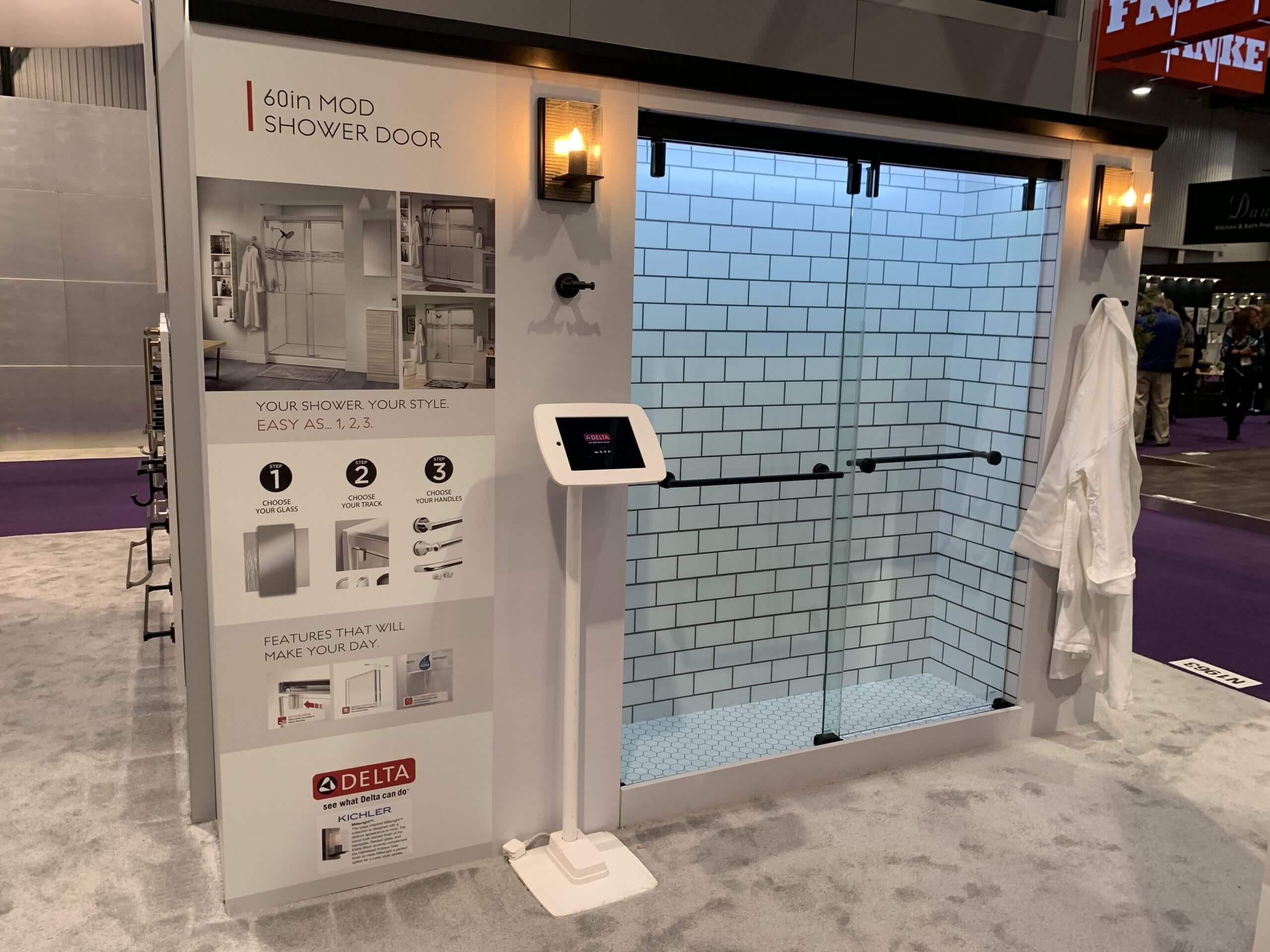 Liberty Hardware exhibit with product display graphics and iPad kiosk