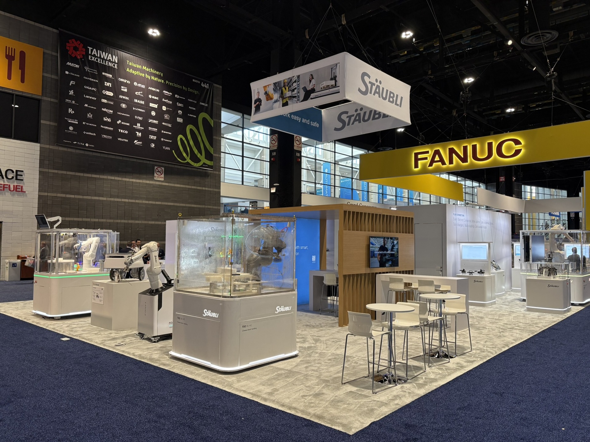 Staubli island custom trade show exhibit at Automate 2026 at McCormick Place in Chicago - corner aisle view